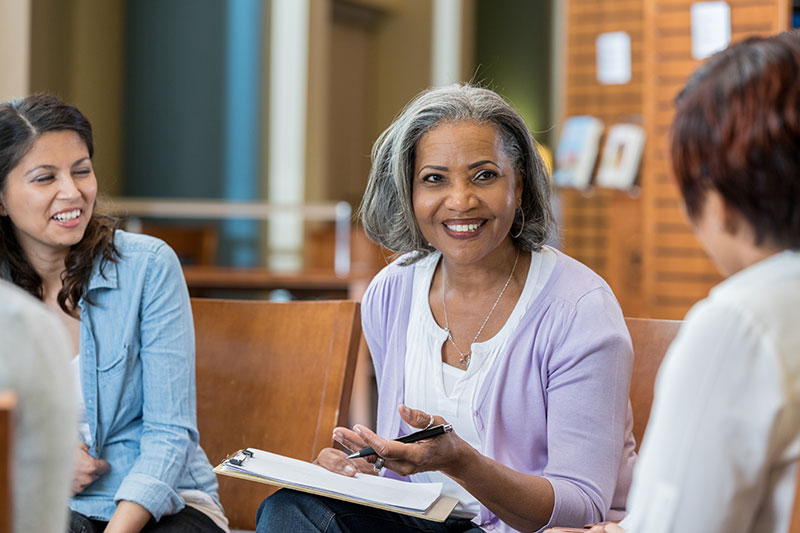 group of woman talking and planning